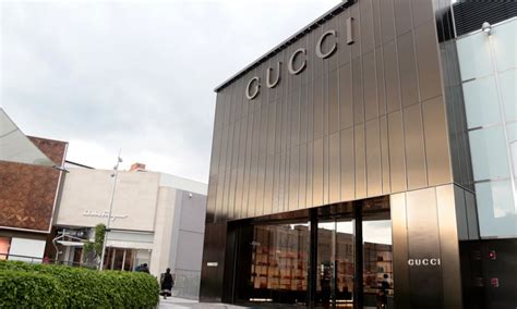 gucci tienda chile|Gucci fundador.